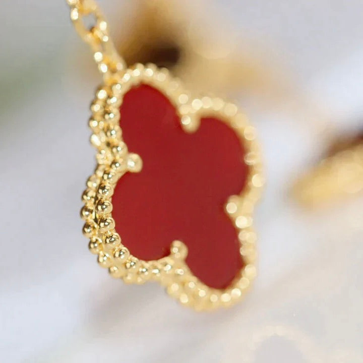 Imperial-Ohrringe mit Kleeblattmotiv und Tigerauge aus Karneol