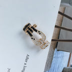 Imperial FORCE Großes Hufeisen-Armband, schwarz-weiß, mit Diamanten besetzt, Roségold