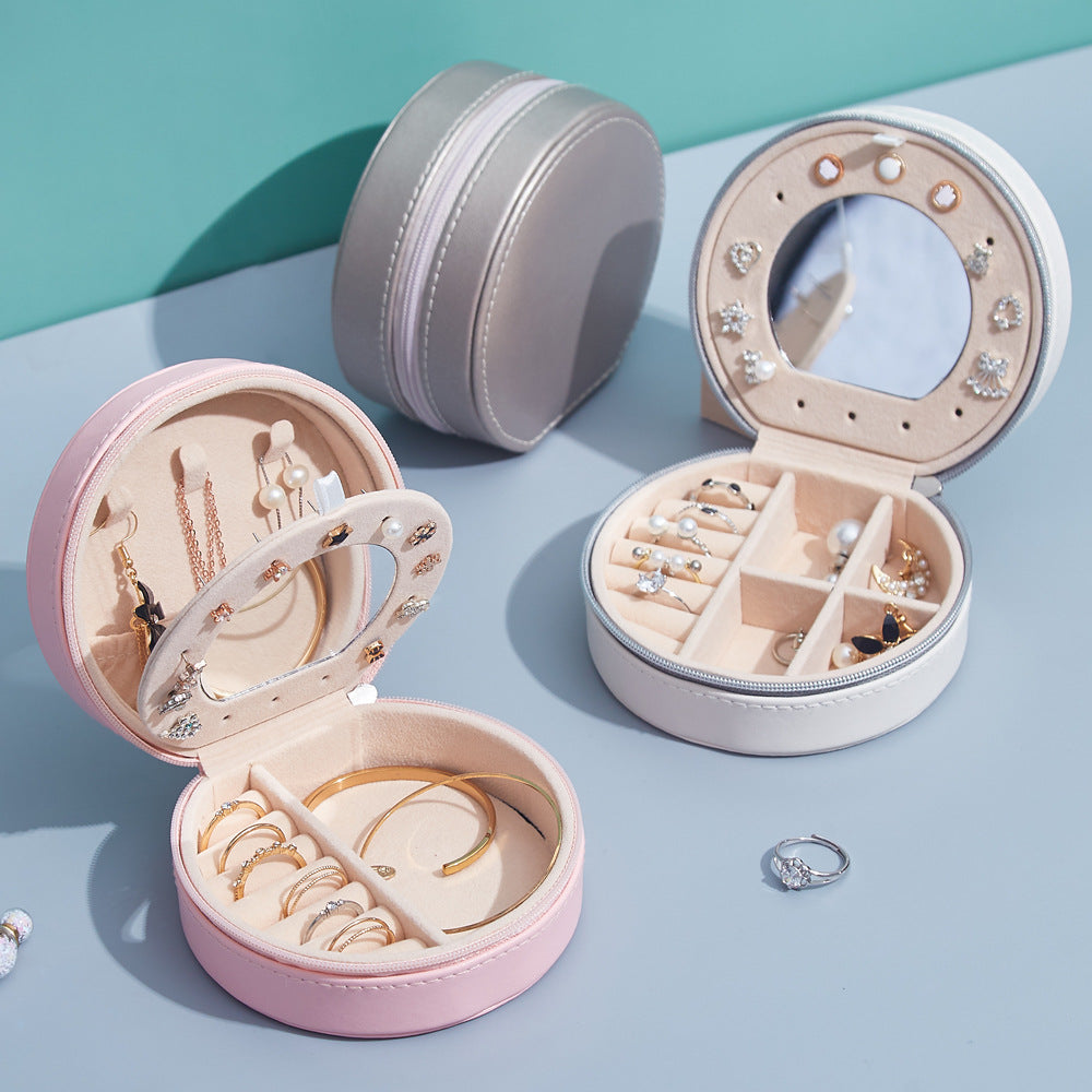 Runde Schmuckschatulle aus Leder, tragbar, ideal für Reisen und zur Aufbewahrung von Schmuck.