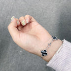 Imperial® Armband mit Kleeblattmotiv, 5 Adern, Onyx, Silber