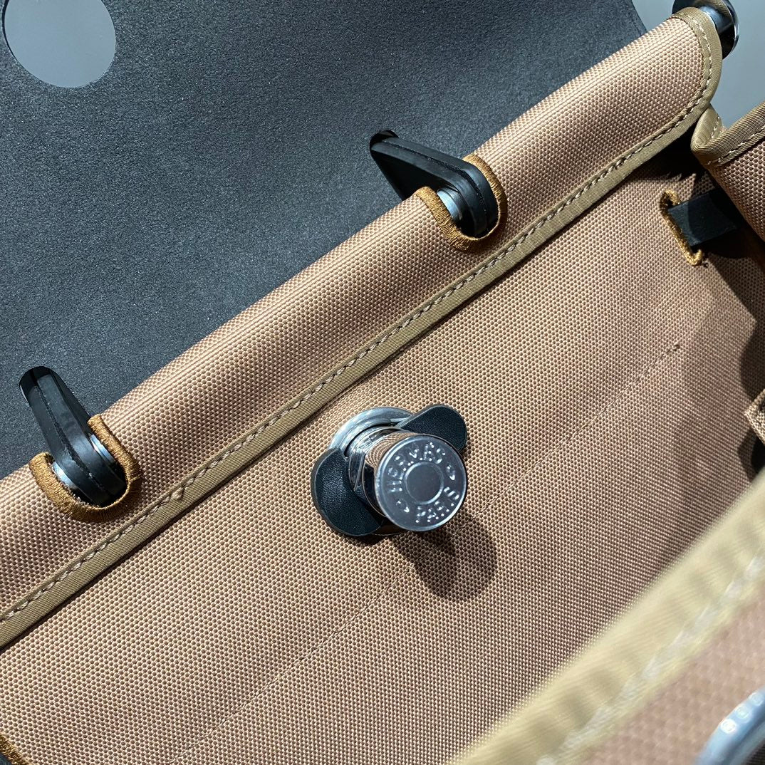 HERBAG A DOS ZIP RETOURNE RUCKSACK 29 IN BRAUNEM CANVAS UND SCHWARZEM KALBSLEDER