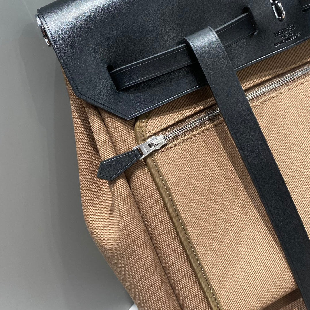 HERBAG A DOS ZIP RETOURNE RUCKSACK 29 IN BRAUNEM CANVAS UND SCHWARZEM KALBSLEDER